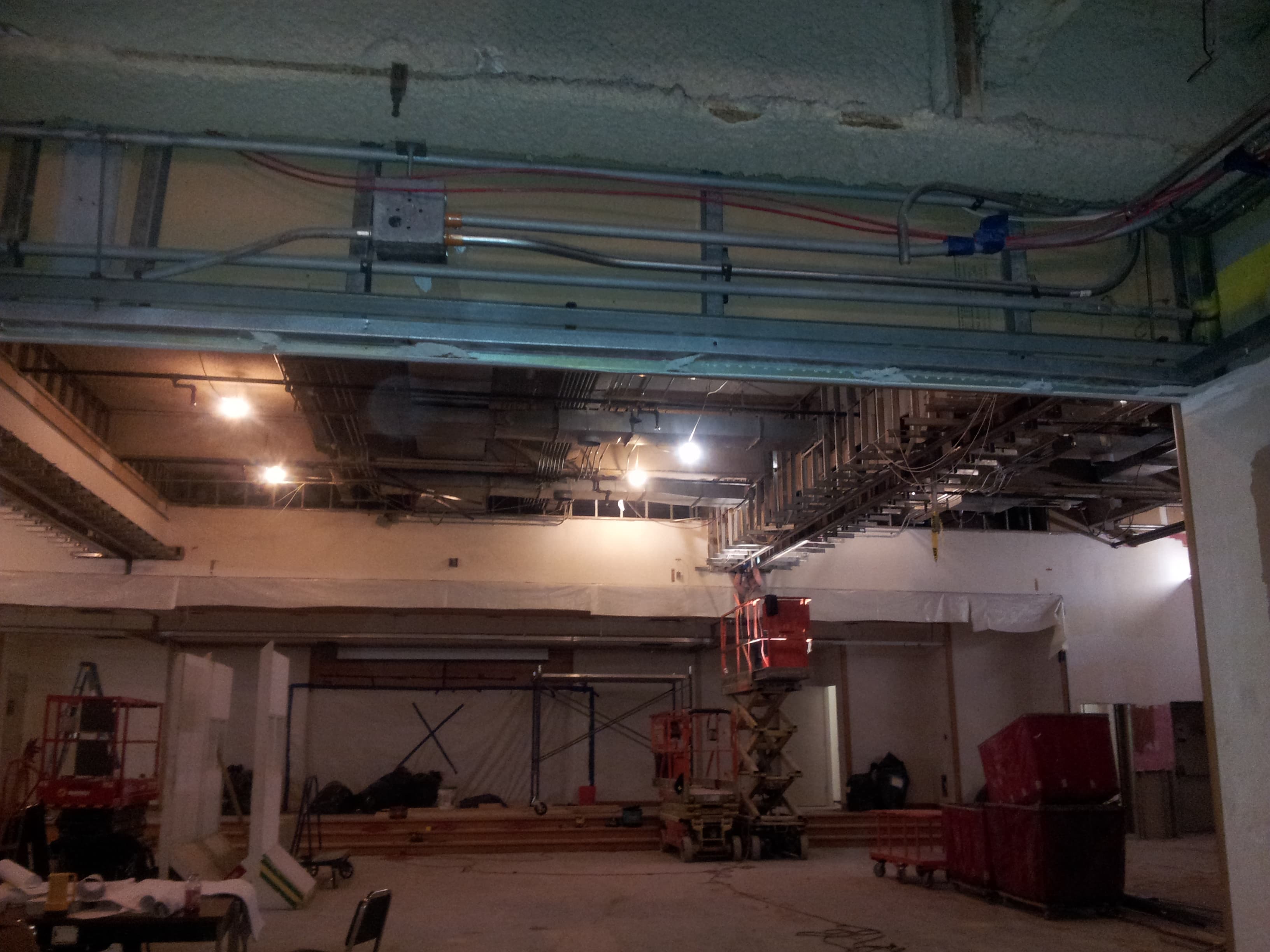 Back stage walkway of an auditorium with view of electrical system near the ceiling